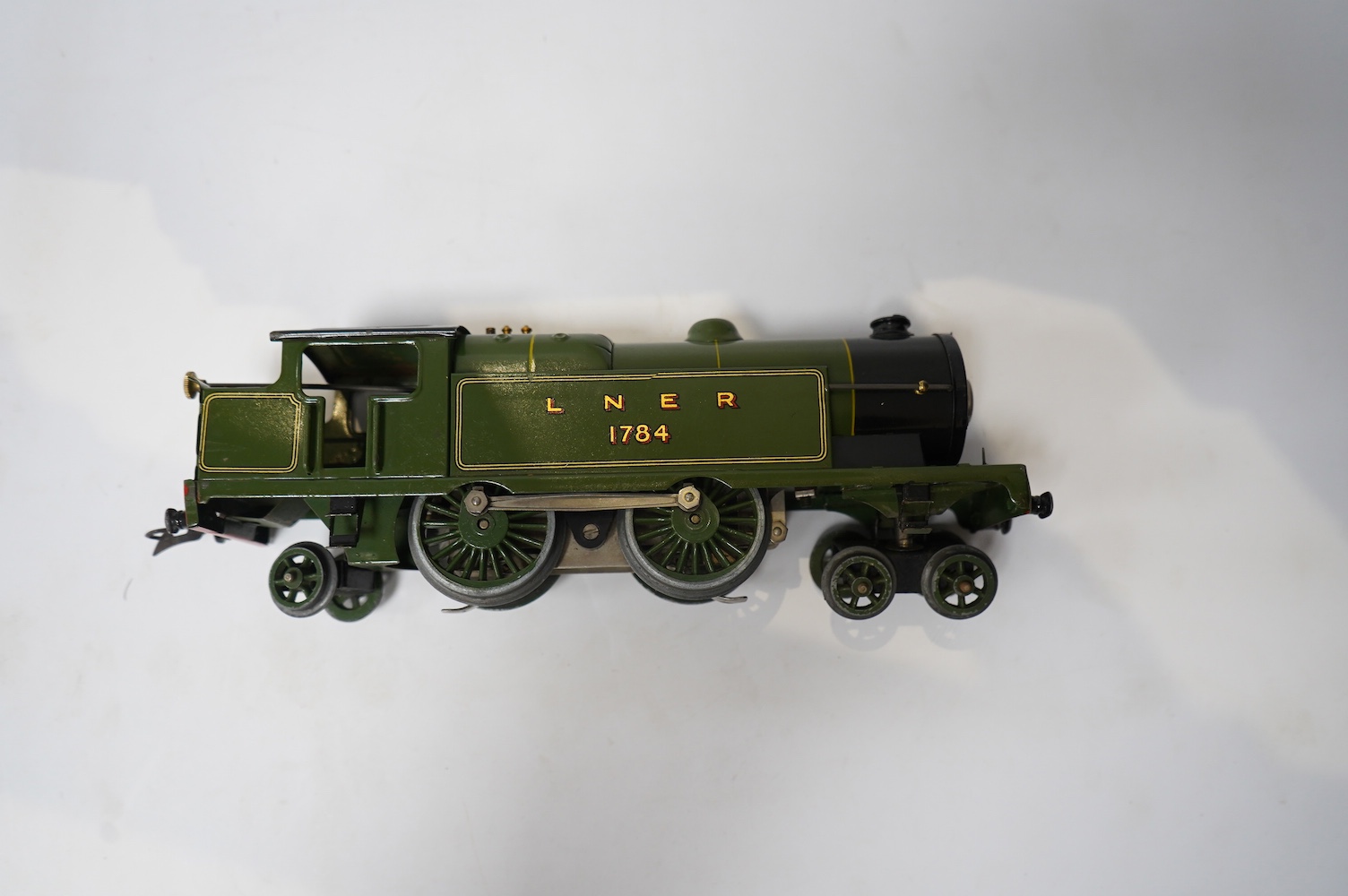 Twenty-four HO gauge model railway by Lima, Trix, Fleischmann, etc. including a German DB 4-6-2 tender locomotive, 10 001, fourteen Continental outline bogie coaches, 4-wheel coaches, and freight wagons. Condition - fair